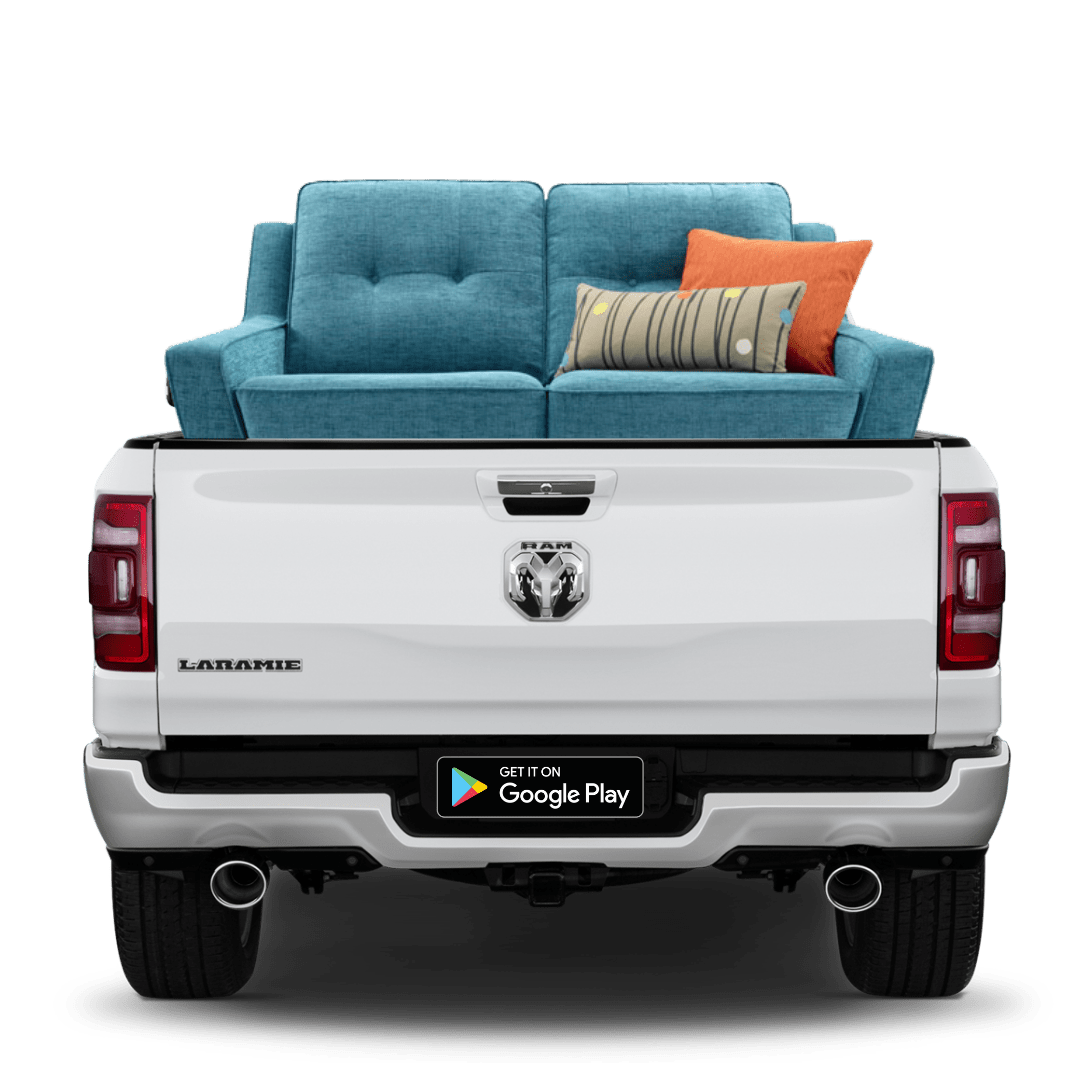 Delivery On Demand Pickup Truck With a Blue Couch on the Back
